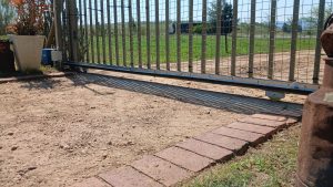 Close-up of the newly installed nylon sliding gate motor rack in Wellington