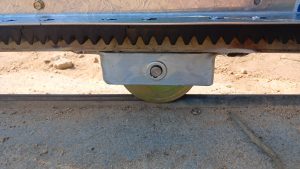 Close-up of a 120 mm sliding gate wheel fitted during a Wellington gate repair